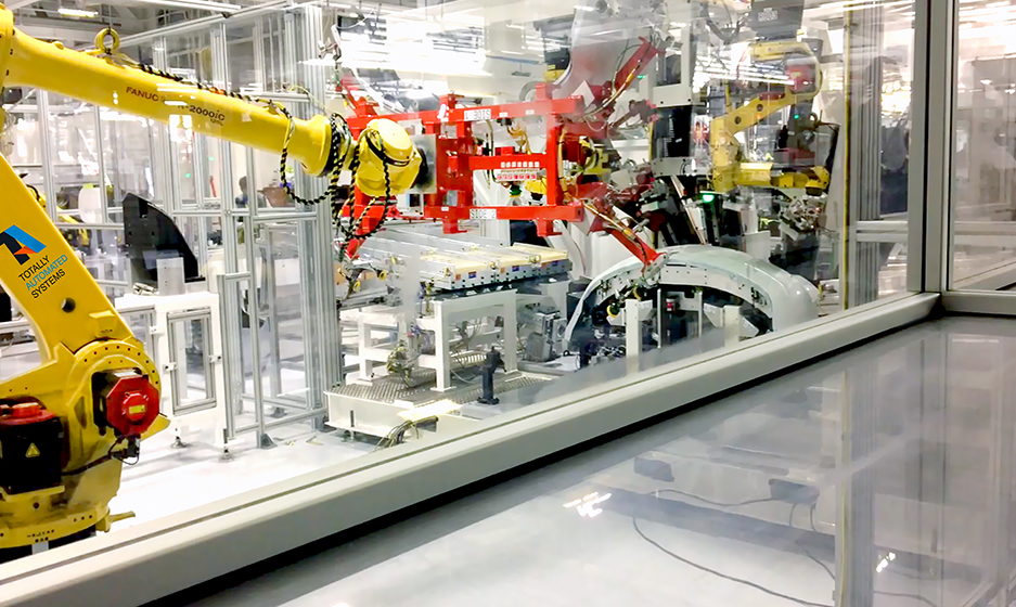 TA Systems Robotic Fascia & Bracket Load & Unload Punch & Weld Applications
